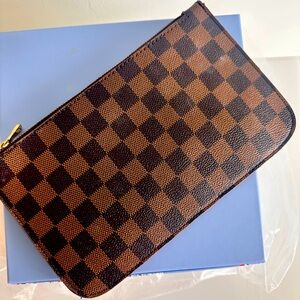 Brown zippered Pouch for traveling or night out.